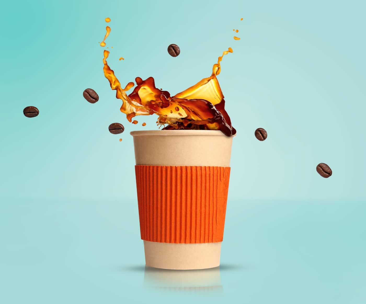 Coffee and beans splashing from a to-go cup at Java Jack's Coffee Bar